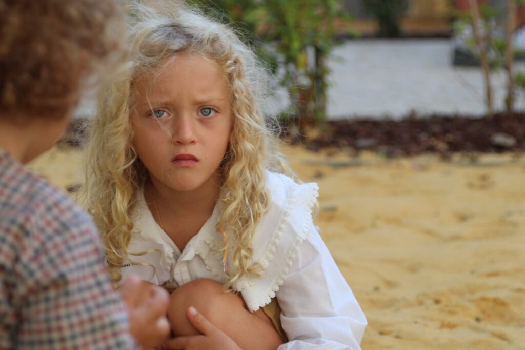 Early Years child playing outdoors
