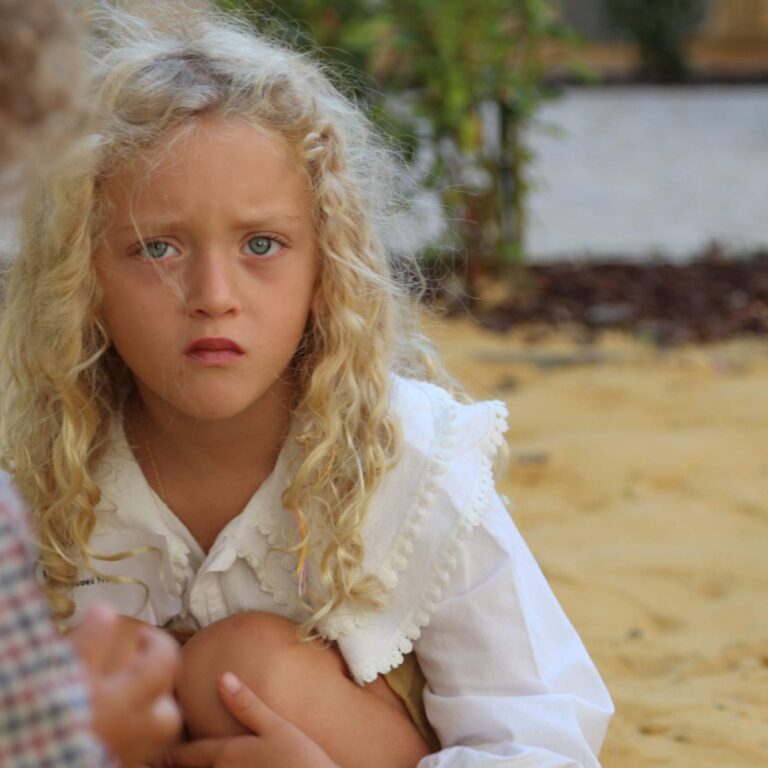 Early Years child playing outdoors