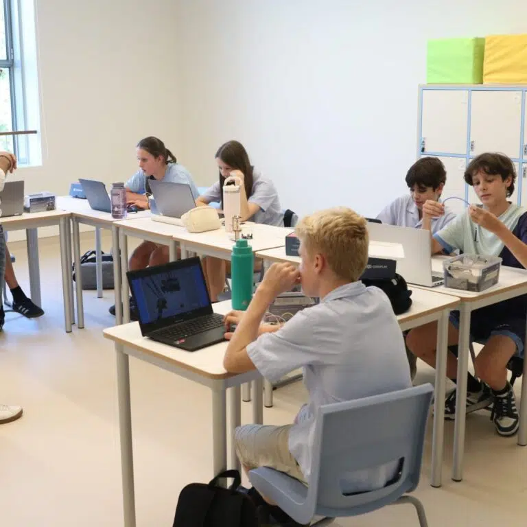 Secondary students with their teacher
