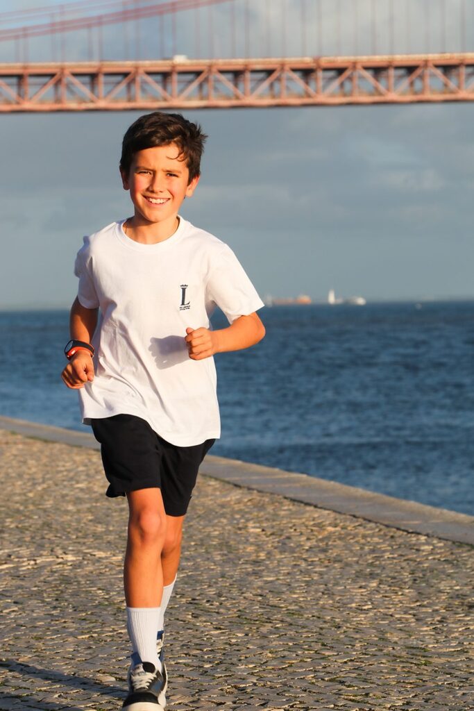 Student running on the beach