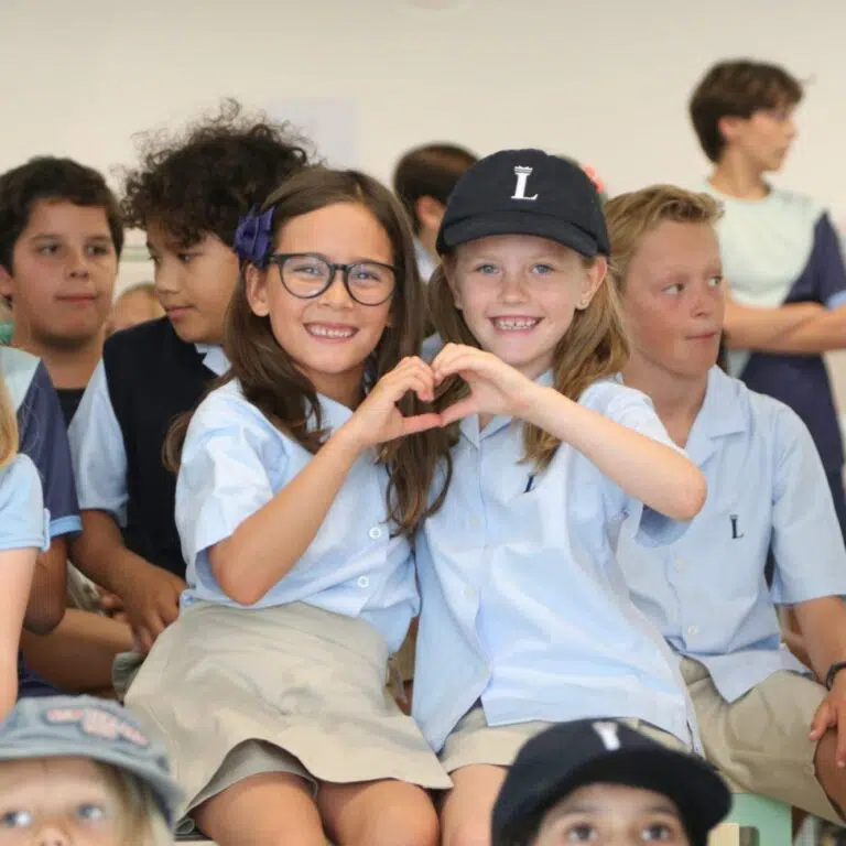 Smiling students at a Lisboan assembly