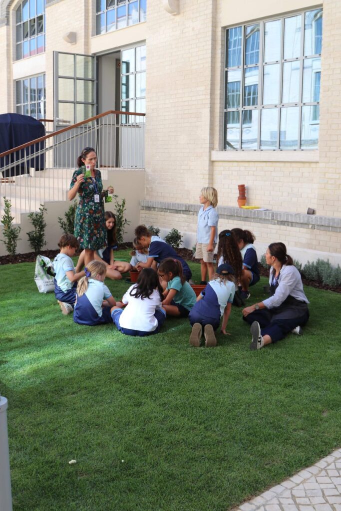 Students gardening together at The Lisboan