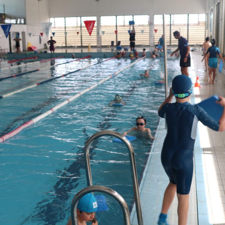 Students swimming at the pool